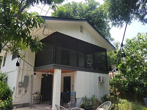 patio screen enclosure on the second story of a house in austin texas